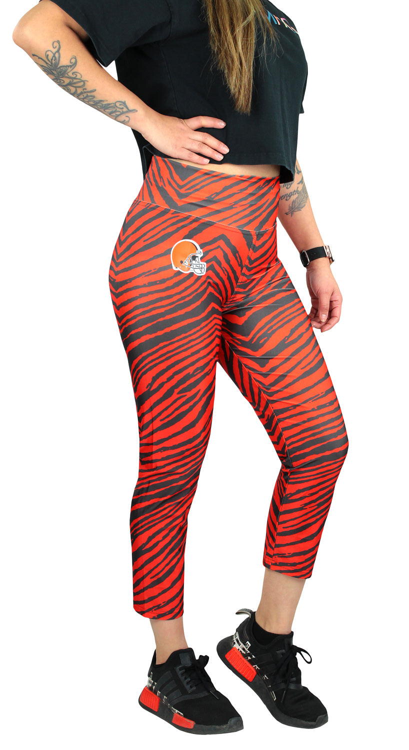 Zubaz NFL Women's CLEVELAND BROWNS BROWN/FIRE ORANGE 2-COLOR ZEBRA CAPRI LEGGING Large