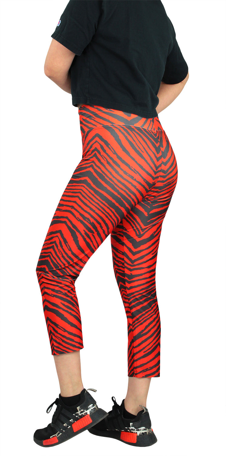 Zubaz NFL Women's CLEVELAND BROWNS BROWN/FIRE ORANGE 2-COLOR ZEBRA CAPRI LEGGING Large